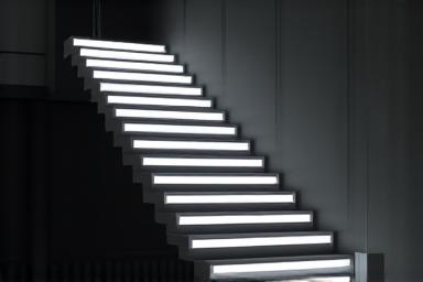 Integrated strip lighting in a floating staircase